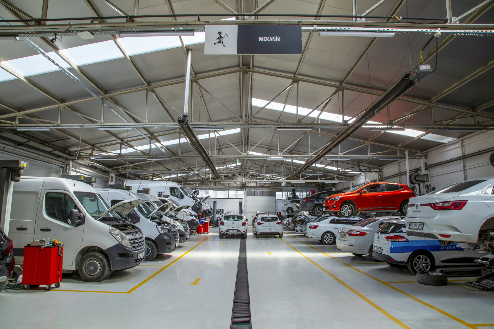 A warehouse filled with lots of cars and trucks
